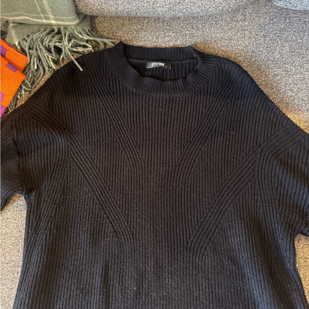 Woman’s Black Ribbed Crewneck Sweater